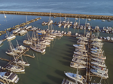 An aerial drone view of boats moored in the marina at Brixham, in Torbay, Devon, Great Britain.