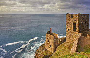 The cliffshide ruins of the engine house of Botallack tin mine, on the Atlantic coast near St Just, Cornwall, Great Britain.