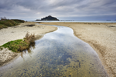 St Michael's Mount in early morning light, seen across the beach at Marazion, near Penzance, Cornwall, Great Britain.