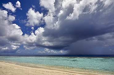 The tumultuous clouds of a tropical thunderstorm gather over the waters off Havodda Island, Gaafu Dhaalu atoll, in the far south of the Maldives, in the Indian Ocean.