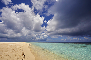 The tumultuous clouds of a tropical thunderstorm gather over the waters off Havodda Island, Gaafu Dhaalu atoll, in the far south of the Maldives, in the Indian Ocean.