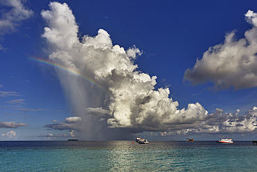 The tumultuous clouds of a tropical thunderstorm gather over the waters off Havodda Island, Gaafu Dhaalu atoll, in the far south of the Maldives, in the Indian Ocean.