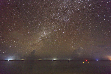 The Milky Way and Southern Cross in the southern night sky, seen from the beach on Havodda Island, Gaafu Dhaalu atoll, close to the equator, in the far south of the Maldives, in the Indian Ocean.