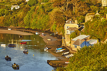 An evening sunlight view of the estuary of the River Avon, with the village of Bantham, on the south coast of Devon, Great Britain.