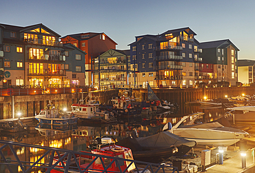 A dusk view of the harbour and surrounding apartments at Exmouth, on the coast of Devon, Great Britain.