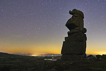 An odd natural granite outcrop against a clear night sky, Bowerman's Nose, Dartmoor National Park, Devon, England, United Kingdom, Europe