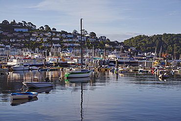 A crowd of boats moored in the harbour in the estuary of the River Dart, at Dartmouth, on the south coast of Devon, England, United Kingdom, Europe