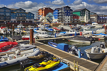 A dusk view of the marina and modern apartments in the revamped dock at Exmouth, on the south coast of Devon, England, United Kingdom, Europe