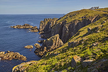 The rugged cliffs of Land's End, Britain's most southwesterly point, in calm summer weather, near Penzance, west Cornwall, England, United Kingdom, Europe