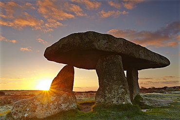 A sunrise view of the remains of a prehistoric burial chamber, known as Lanyon Quoit, near Penzance, west Cornwall, England, United Kingdom, Europe