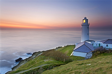 A peaceful dusk on Cornwall's Atlantic coast, showing the lighthouse at Trevose Head, near Padstow, Cornwall, England, United Kingdom, Europe