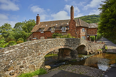 The packhorse bridge and old cottages in the village of Allerford, Exmoor National Park, Somerset, England, United Kingdom, Europe