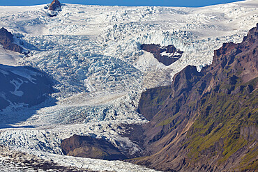 A spectacular glacier pouring down off the Vatnajokull icecap, Svinafellsjokull Glacier, Skaftafell National Park, Iceland, Polar Regions