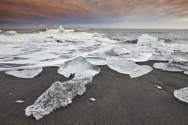 Melting glacial ice, carved from the Vatnajokull icecap, on the beach at Jokulsarlon, on the south coast of Iceland, Polar Regions