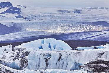 A retreating glacier, pouring down from the Vatnajokull icecap, in Skaftafell National Park, southern Iceland, Polar Regions