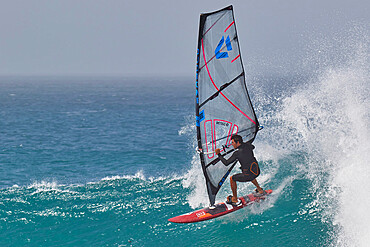 Wind-surfing on Atlantic rollers at Ponta Preta, southwest coast of Sal, Cape Verde Islands, Atlantic, Africa