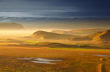 An inland view towards Mydralsjokull, seen from Dyrholaey Island, just before sunset, near Vik, southern Iceland, Polar Regions