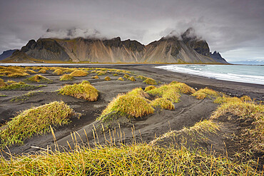 The black sand dunes and cliffs of Vestrahorn seen from Stokksnes, near Hofn, southeast Iceland, Polar Regions