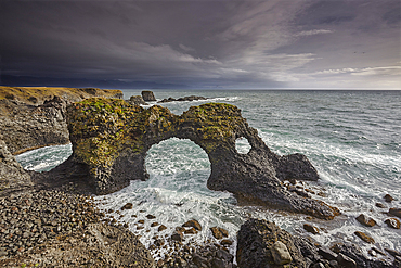 A huge lava arch, pounded by Atlantic surf, at Arnastapi, in Snaefellsjokull National Park, on the Snaefellsnes peninsula, west coast of Iceland, Polar Regions