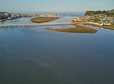 An evening view of the harbour and mouth of the River Teign, plus Shaldon Bridge, with Teignmouth on the left and Shaldon on the right, on the south coast of Devon, England, United Kingdom, Europe