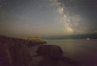 An autumn view of the Milky Way over the Atlantic Ocean, seen from the cliffs of Land's End, the most southwesterly point of Great Britain, Cornwall, England, United Kingdom, Europe