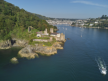 An aerial view of the historic 16th century Dartmouth Castle, in the mouth of the River Dart, with a view of Dartmouth in the background, on the south coast of Devon, England, United Kingdom, Europe