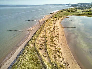 Aerial view of beach and dunes at Dawlish Warren, guarding the mouth of the River Exe, looking south along the coast towards the town of Dawlish, Devon, England, United Kingdom, Europe