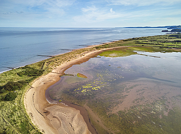 Aerial view of beach and dunes at Dawlish Warren, guarding the mouth of the River Exe, looking south along the coast towards the town of Dawlish, Devon, England, United Kingdom, Europe