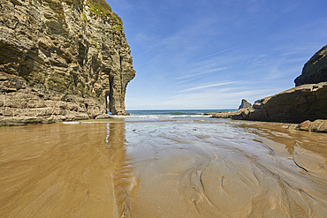 Cliffs and the shoreline, seen at low tide, in Bossiney Haven, near Tintagel, Cornwall, England, United Kingdom, Europe