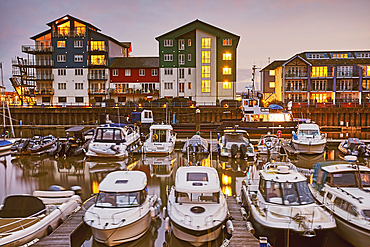 A dusk view of the marina (harbour) and adjacent apartments at Exmouth, east Devon, England, United Kingdom, Europe