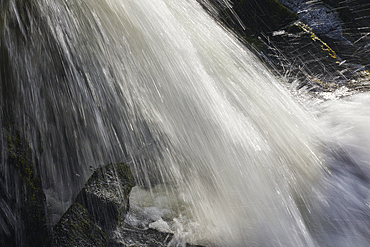 Waterfall shot with a slow shutter speed, resulting in blurred motion, at Welcombe Mouth, Hartland, north Devon, England, United Kingdom, Europe