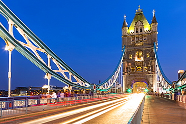 Light trails on Tower Bridge at sunset in London, England, Europe