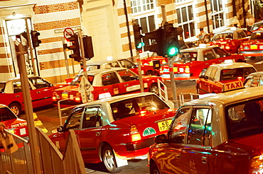 Traffic jam of red Hong Kong taxis, Hong Kong, China, Asia