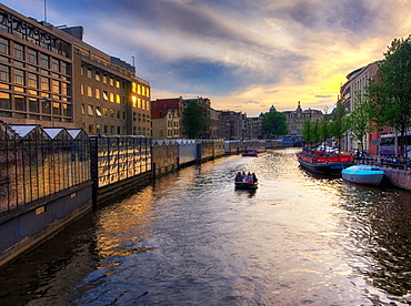 Sunset at Bloemenmarkt, the floating flower market, Amsterdam, The Netherlands, Europe