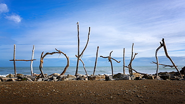 Hokitika coast and sign made of drift wood, Hokitika, West Coast of South Island, New Zealand, Pacific