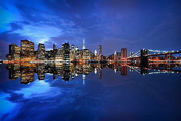 Brooklyn Bridge and Manhattan skyline at dusk, New York City, New York, United States of America, North America