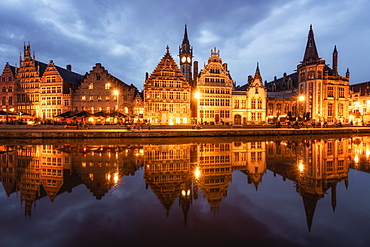 Graslei in the historic city of Ghent reflected in Leie river during blue hour, Ghent, East Flanders, Belgium, Europe