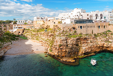 View of beach and old town on limestone cliffs, Polignano a Mare, Puglia, Italy, Europe