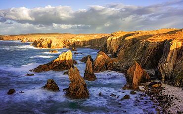 Mangersta Sea Stacks bathed in golden afternoon light, Isle of Lewis, Outer Hebrides, Scotland, United Kingdom, Europe