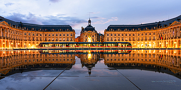 Tram at the Miroir D'Eau, Place de la Bourse, at blue hour, Bordeaux, Gironde, Aquitaine, France, Europe