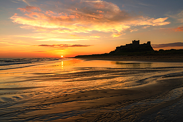 Bamburgh Castle at sunrise, Northumberland, England, UK