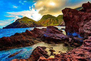 Rocky island mountains meet the beautiful blue of the ocean on Saba Island, Netherlands Antilles, West Indies, Caribbean, Central America