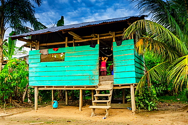 Child at a home in a local village, Pacaya Samiria, Peru, South America