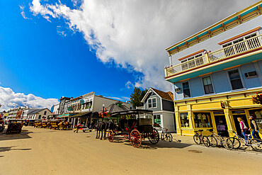 Horse and carriage filled streets lined with beautiful colorful buildings, Mackinac Island, Michigan, United States of America, North America