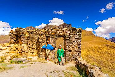 Woman exploring Inti Punku (Sun Gate), Cusco, Peru, South America