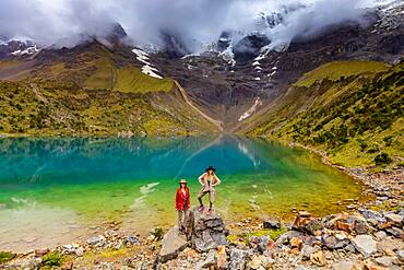 Two woman trekking Humantay Lake, Cusco, Peru, South America