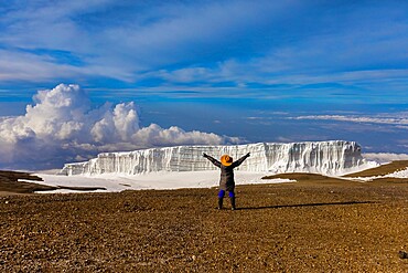 Woman enjoying the view on her way up Mount Kilimanjaro, UNESCO World Heritage Site, Tanzania, East Africa, Africa