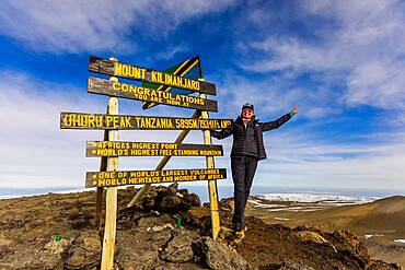 Woman excited she made it to Uhuru Peak on Mount Kilimanjaro, UNESCO World Heritage Site, Tanzania, East Africa, Africa