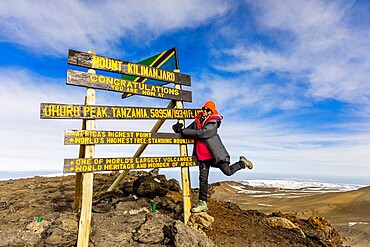 Woman excited she made it to Uhuru Peak on Mount Kilimanjaro, UNESCO World Heritage Site, Tanzania, East Africa, Africa