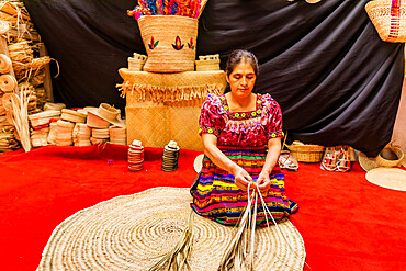 K'iche artisans showing off their beautiful woven straw hats, Guatemala, Central America